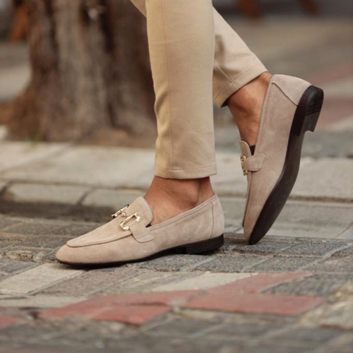 Men's beige horsebit loafers with classic slip-on design for smart casual and formal occasions