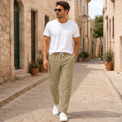 Men's beige linen pants with lightweight fabric, relaxed fit and straight-leg design