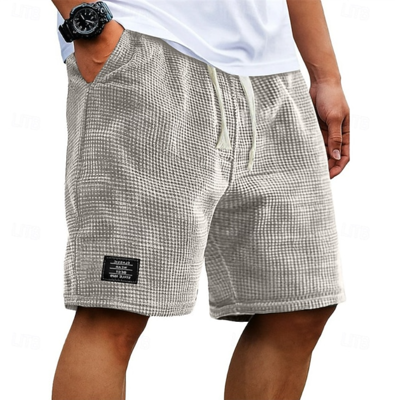shorts-relaxed-fit
Men's beige waffle shorts with relaxed fit, textured fabric, drawstring waist and side pockets