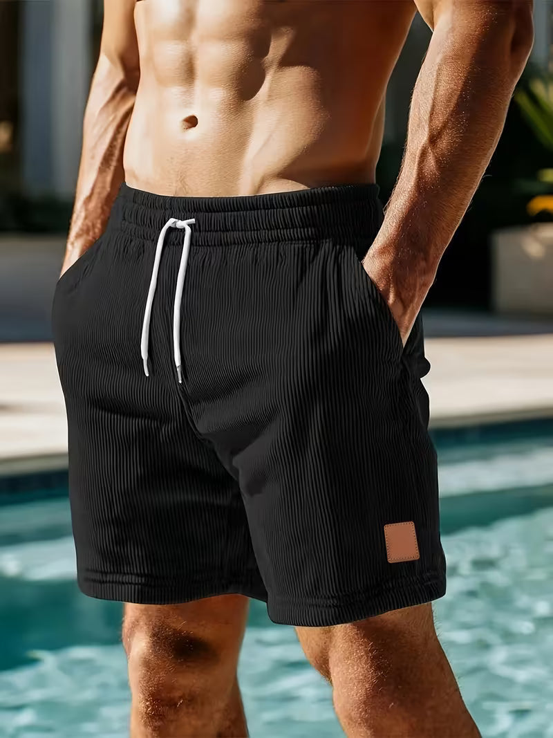 Men's black corduroy jogger shorts with relaxed fit and elasticated waistband