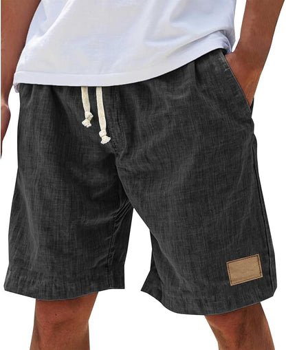 Men's black cotton shorts with relaxed fit, elasticated drawstring waist and side pockets