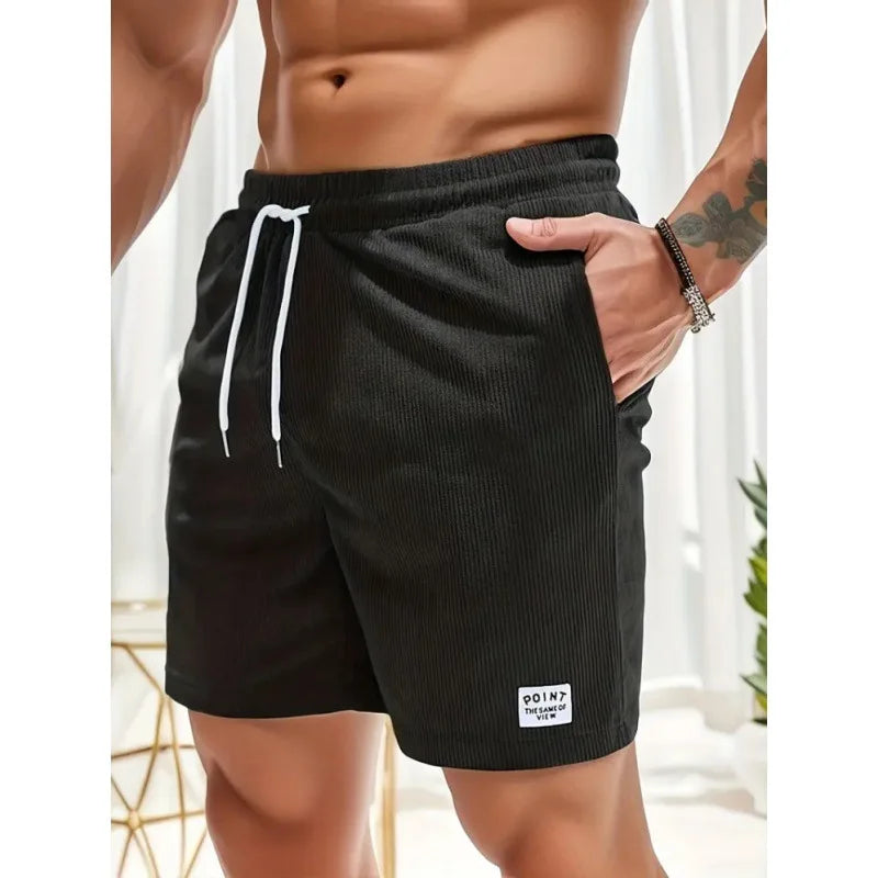 Men's black drawstring summer shorts with relaxed fit and practical pockets