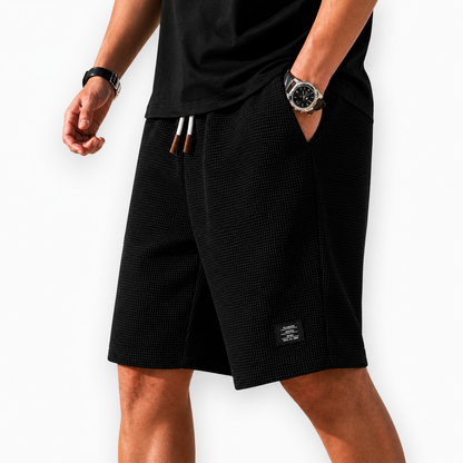 Men's black lightweight summer shorts with regular fit and elasticated waist for versatile summer outfits