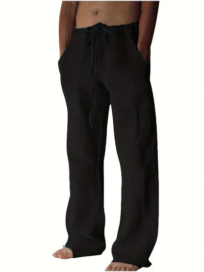 Men's black linen drawstring trousers with relaxed wide leg fit and elasticated waistband