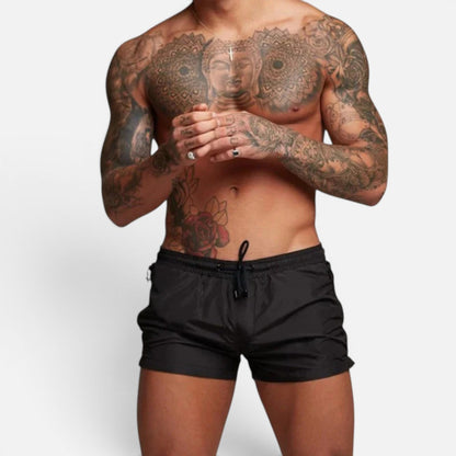 Men's black stretch swim trunks with quick-dry design and adjustable drawstring waist