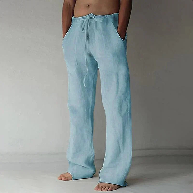 Men's blue linen drawstring trousers with relaxed wide leg fit and elasticated waistband