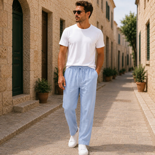 Men's blue linen pants with lightweight fabric, relaxed fit and straight-leg design