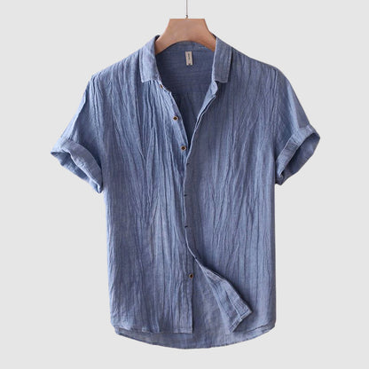 Men's blue linen shirt with short sleeves, relaxed fit and crinkle textured finish