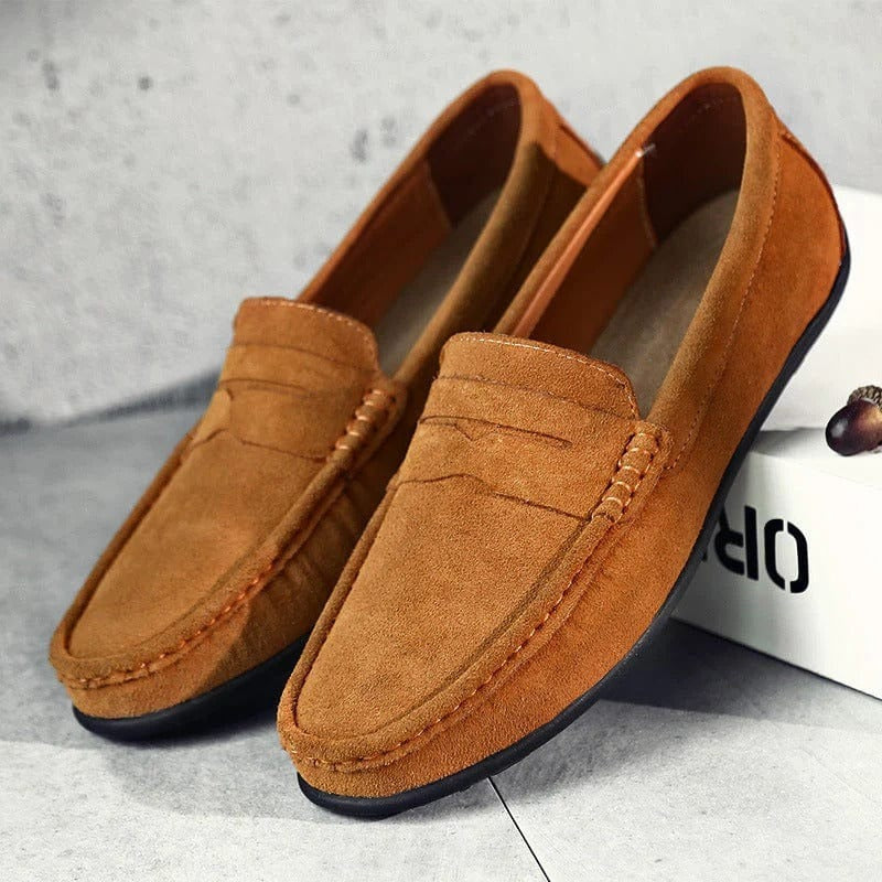 Men's brown synthetic strap loafers with classic top band and low-profile design