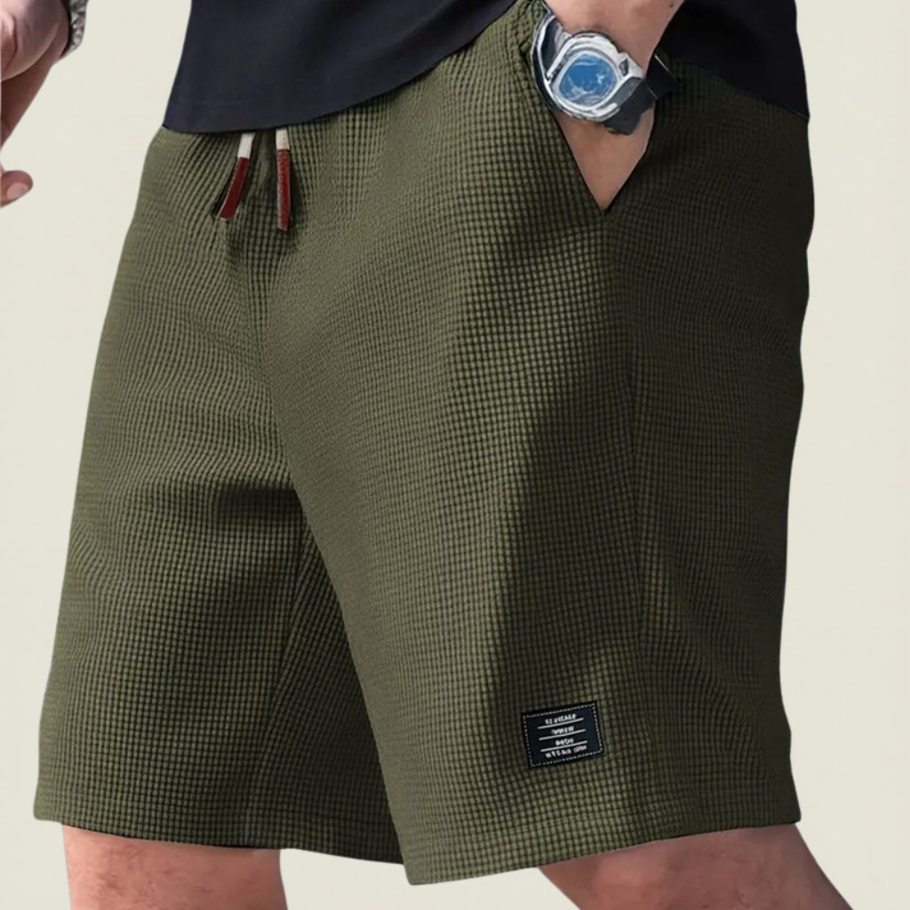 Men's dark green lightweight summer shorts with regular fit and elasticated waist for relaxed summer outfits