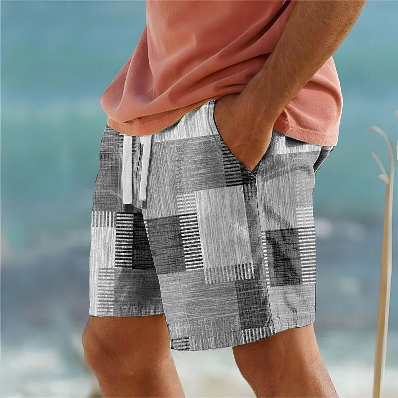 Men's grey patchwork swim shorts with relaxed fit and adjustable drawstring