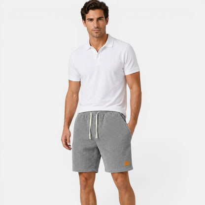 Men's grey corduroy shorts with lightweight textured fabric for refined casual summer styling