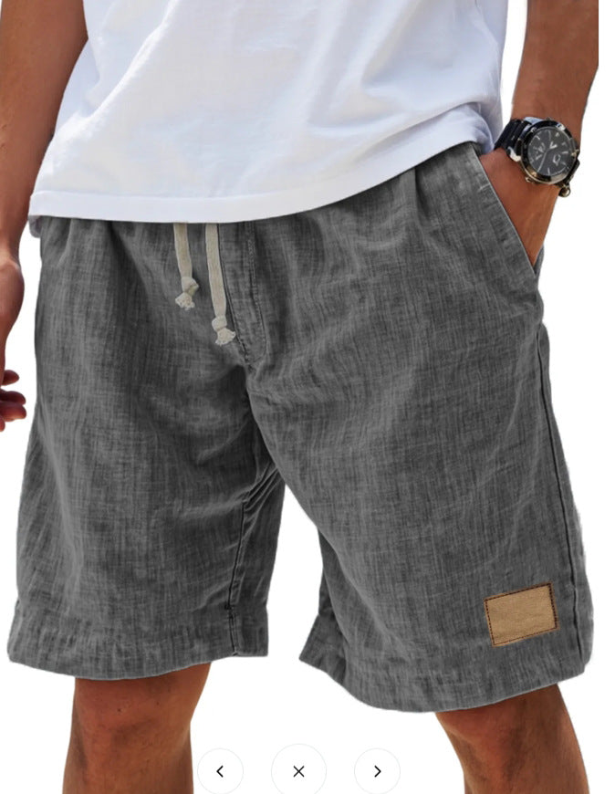 Men's grey cotton shorts with relaxed fit, elasticated drawstring waist and side pockets