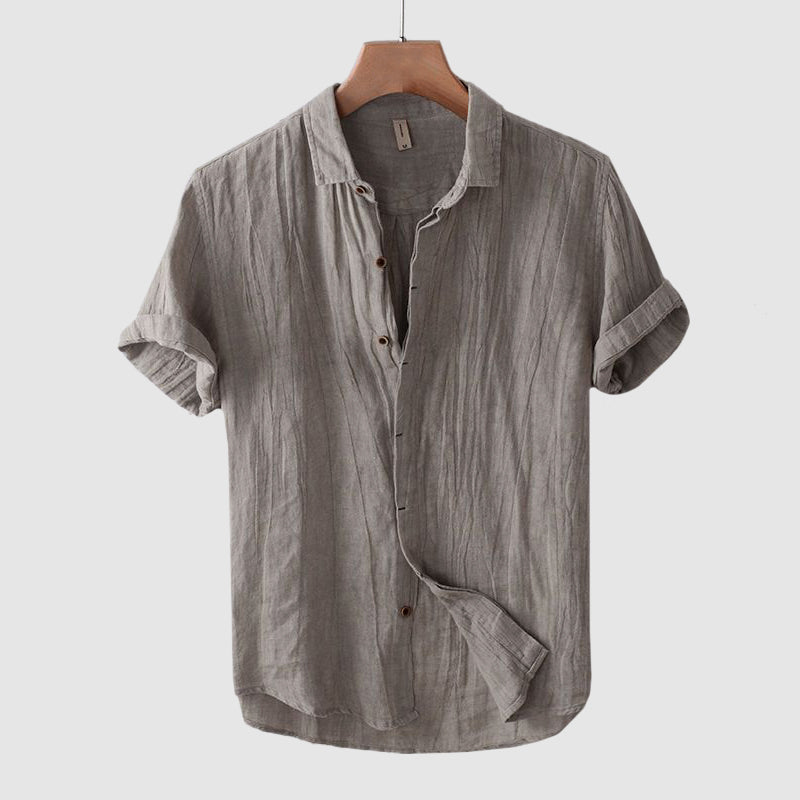 Men's grey linen shirt with short sleeves, relaxed fit and crinkle textured finish