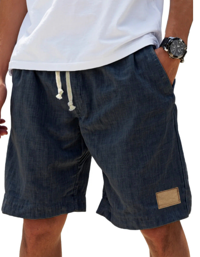 Men's navy blue cotton shorts with relaxed fit, elasticated drawstring waist and side pockets