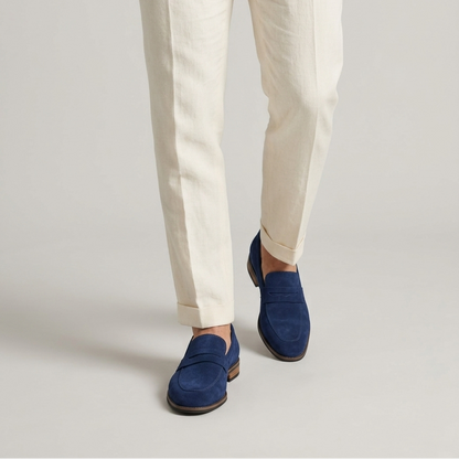 Men's royal blue synthetic loafers with classic strap detail and slip-on design for distinctive smart casual style