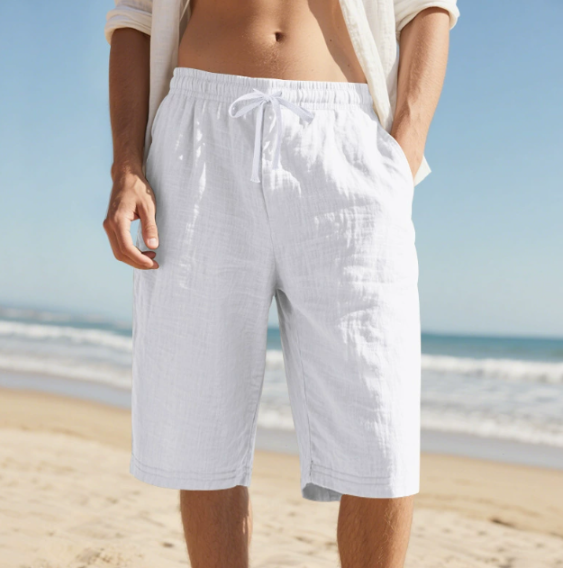 Men's white relaxed fit beach shorts with elasticated waist and adjustable cord for summer wear